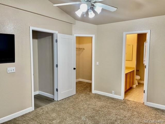 12337 Crystal Downs Road Peyton, CO 80831 - Photo 16 of 22 an empty room with closet and a chandelier fan