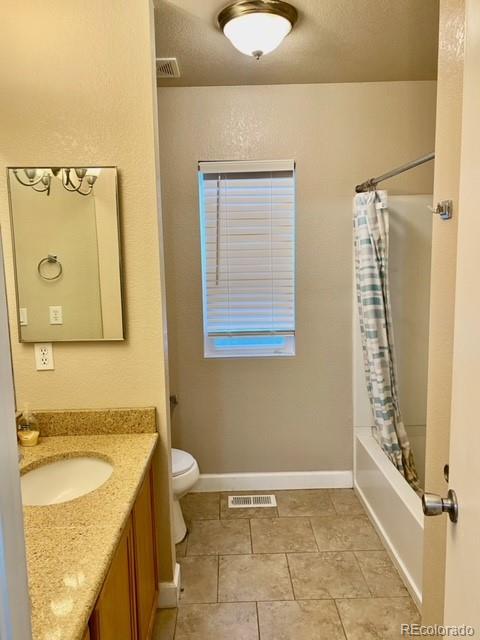 12337 Crystal Downs Road Peyton, CO 80831 - Photo 19 of 22 a bathroom with a granite countertop sink toilet and shower