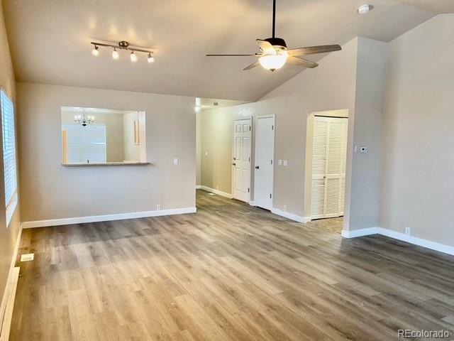 12337 Crystal Downs Road Peyton, CO 80831 - Photo 4 of 22 a view of an empty room with window and wooden floor