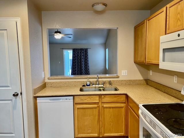 12337 Crystal Downs Road Peyton, CO 80831 - Photo 5 of 22 a bathroom with a granite countertop sink and a mirror