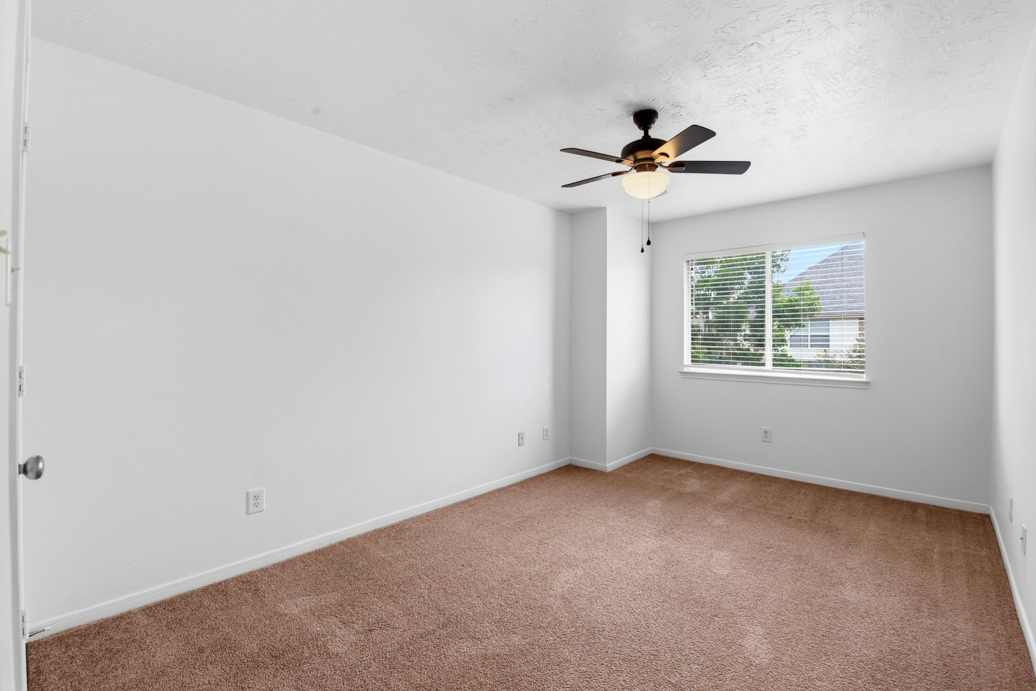 22102 Bridgestone Crossing Drive Spring, TX 77388 - Photo 34 of 38 an empty room with windows and fan