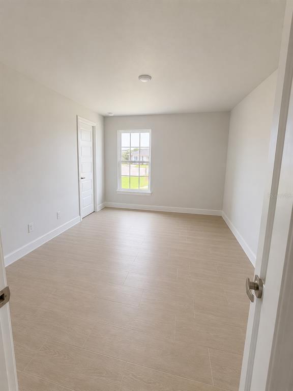 5892 Southwest 82nd Lane Ocala, FL 34476 - Photo 14 of 24 an empty room with windows