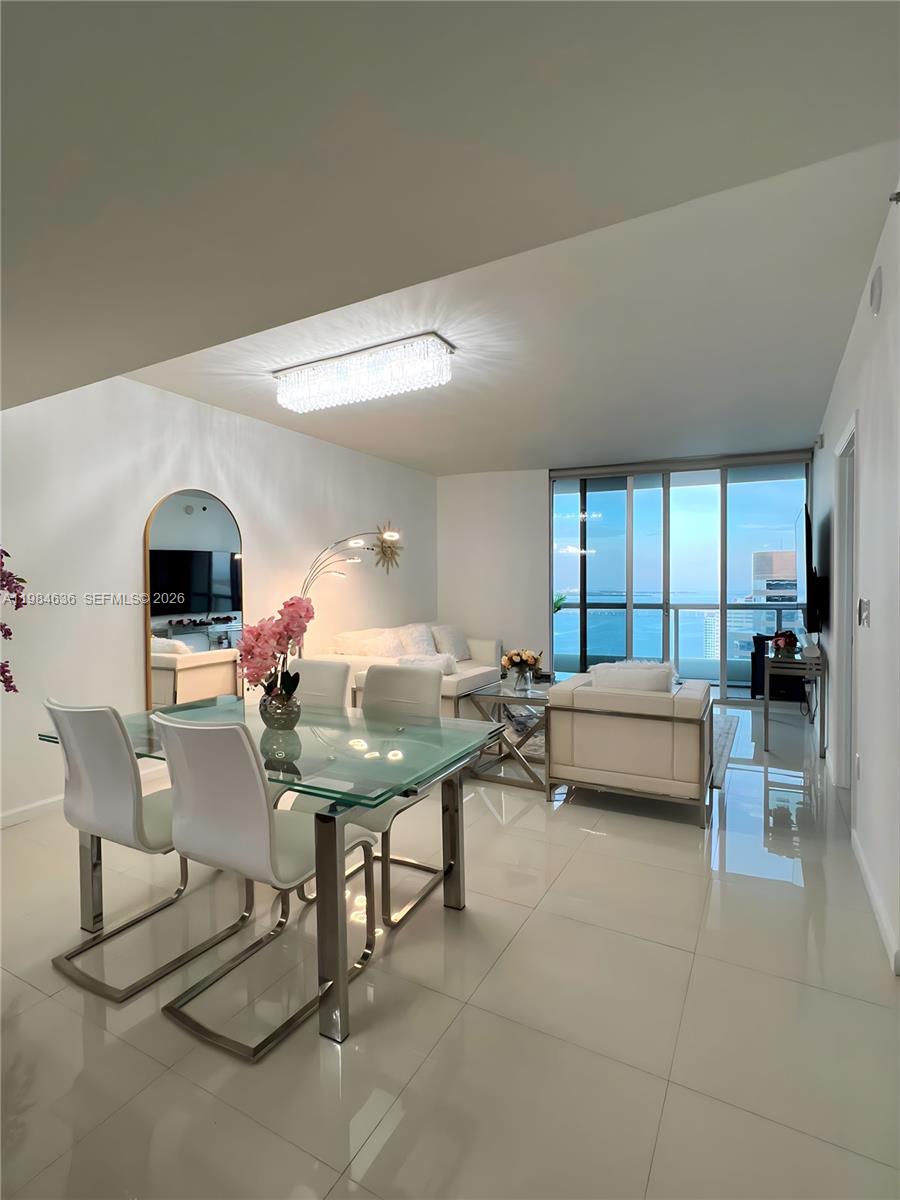 485 Brickell Avenue, Unit 4109 Miami, FL 33131 - Photo 6 of 15 a living room with furniture and a table