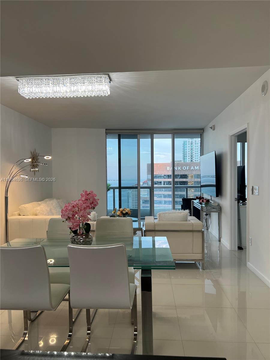 485 Brickell Avenue, Unit 4109 Miami, FL 33131 - Photo 8 of 15 a living room with furniture and a large window