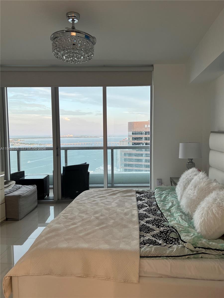 485 Brickell Avenue, Unit 4109 Miami, FL 33131 - Photo 10 of 15 a bedroom with a large bed and a large window