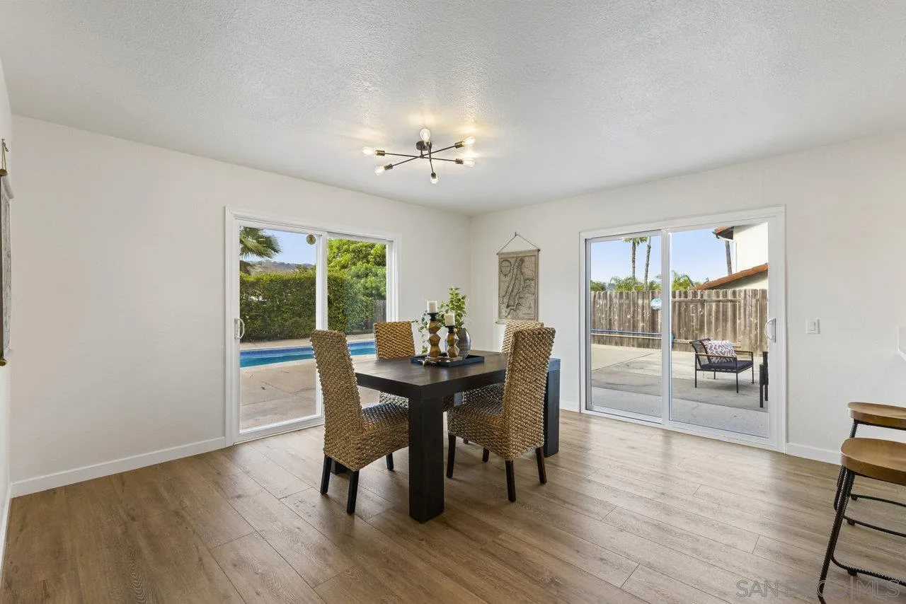 1066 Fulton Road San Marcos, CA 92069 - Photo 11 of 36 a view of a dining room with furniture window and wooden floor