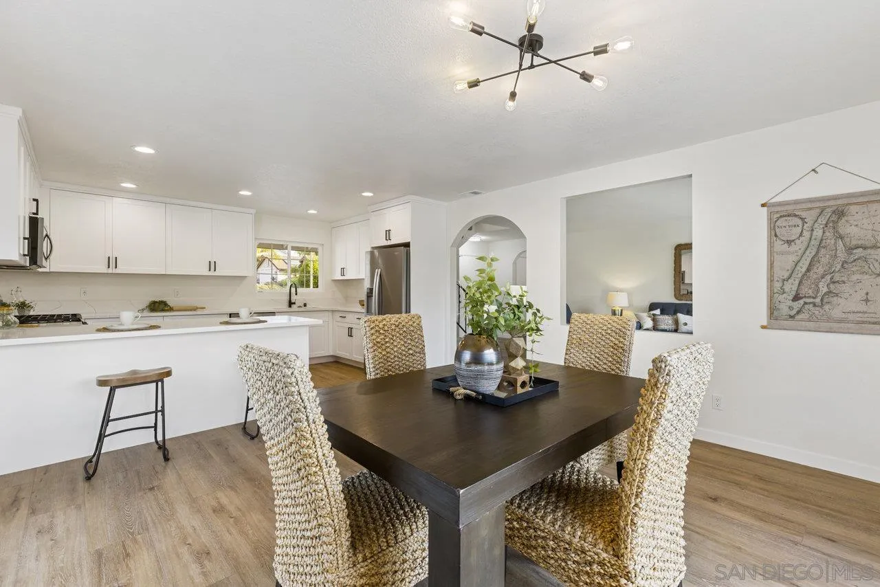 1066 Fulton Road San Marcos, CA 92069 - Photo 12 of 36 a view of a dining room with furniture and wooden floor