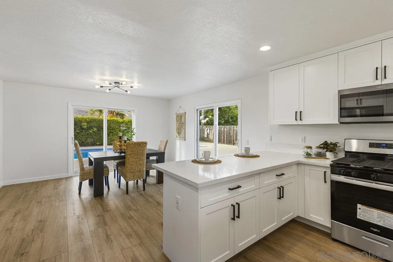 1066 Fulton Road San Marcos, CA 92069 - Photo 14 of 36 a kitchen with a sink stove and cabinets