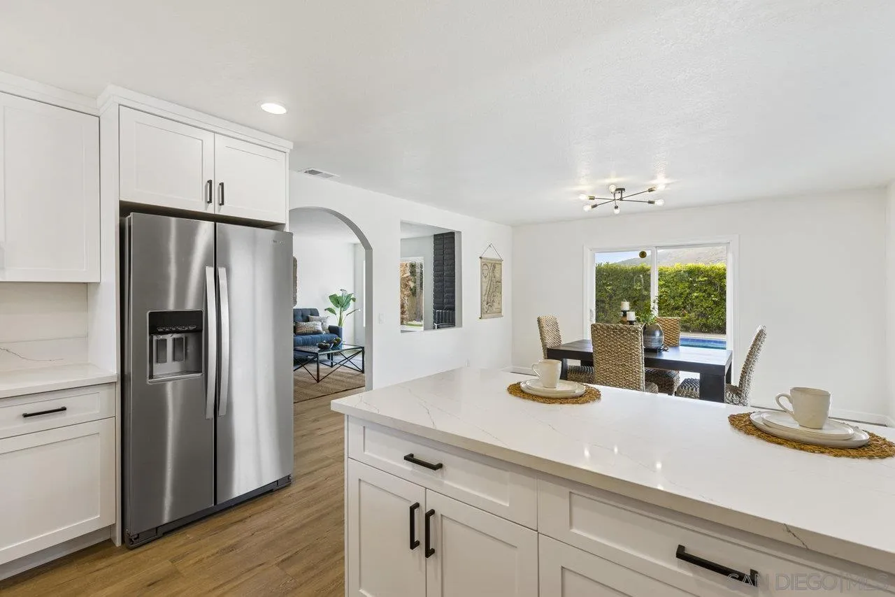 1066 Fulton Road San Marcos, CA 92069 - Photo 16 of 36 a kitchen with a refrigerator and a sink