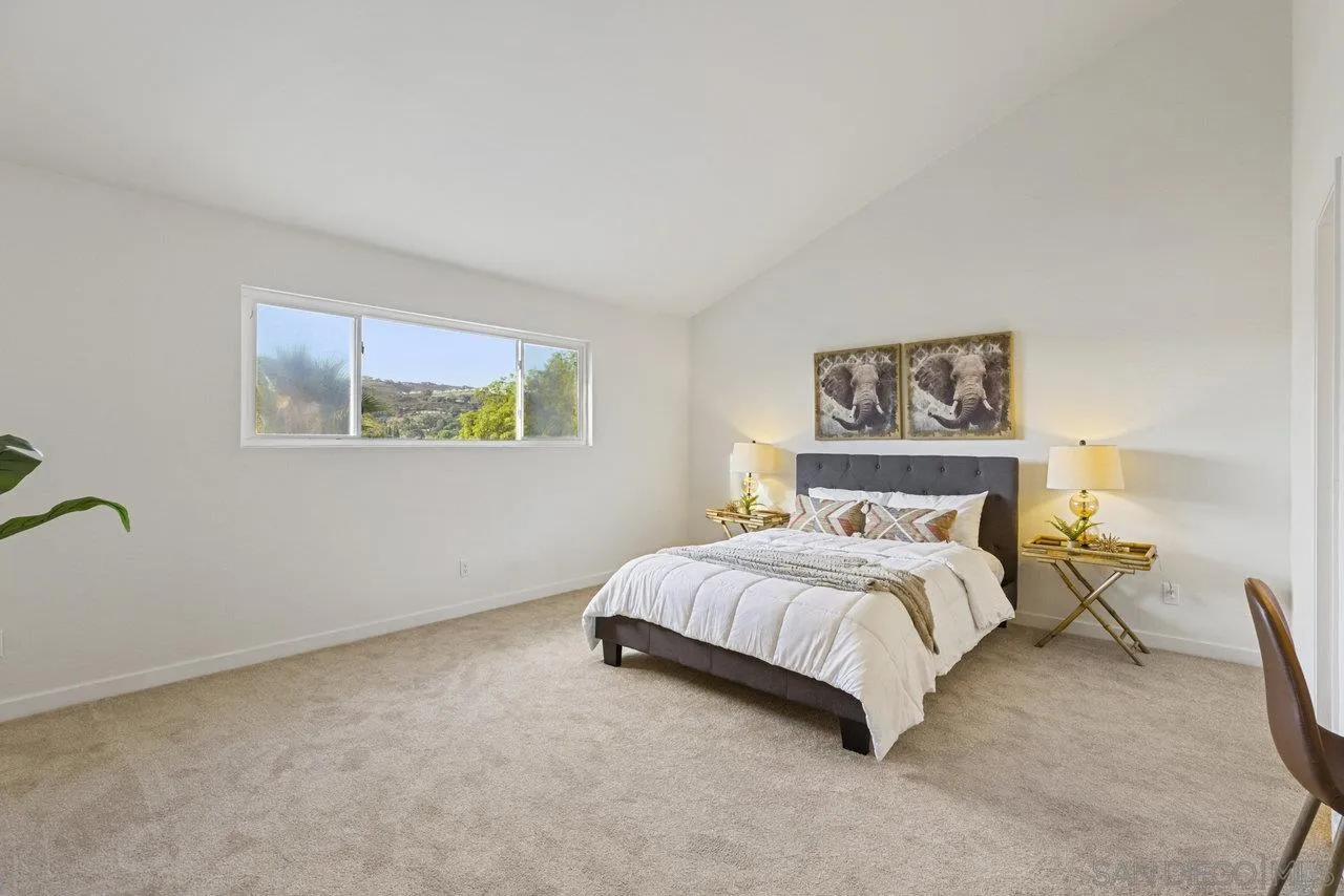 1066 Fulton Road San Marcos, CA 92069 - Photo 22 of 36 a bedroom with a bed and a painting on the wall