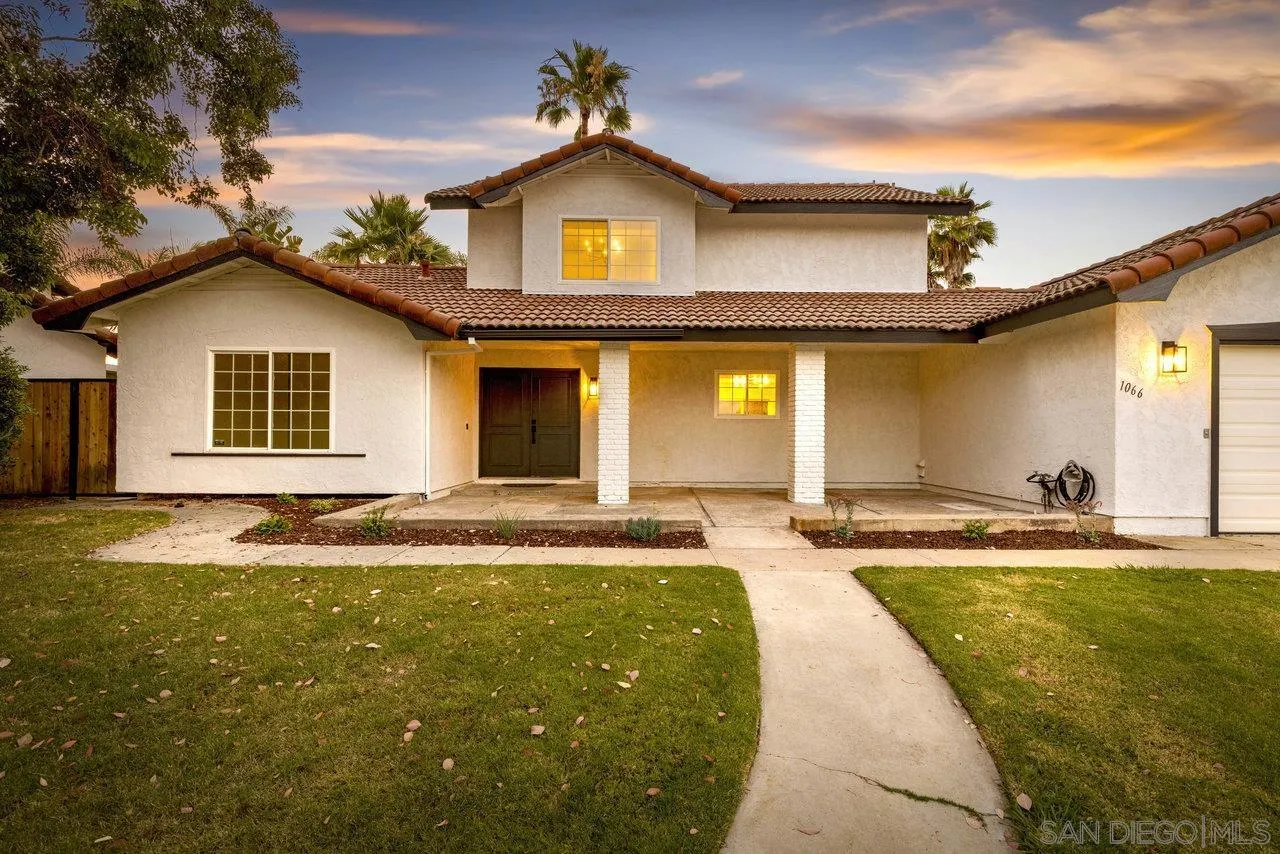 1066 Fulton Road San Marcos, CA 92069 - Photo 27 of 36 a view of a house with swimming pool and a yard