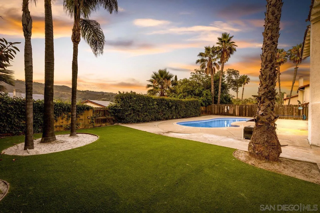 1066 Fulton Road San Marcos, CA 92069 - Photo 32 of 36 a view of a swimming pool with a yard