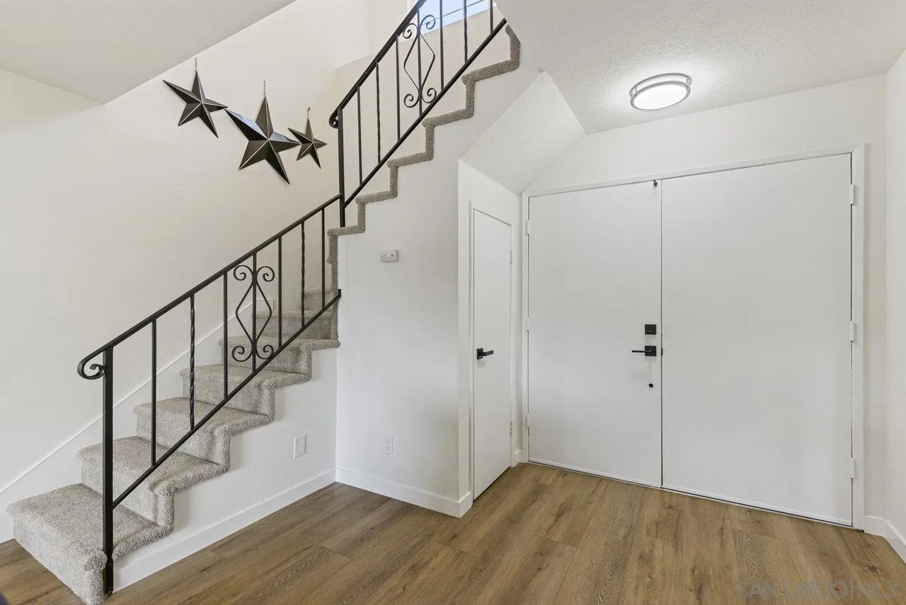 1066 Fulton Road San Marcos, CA 92069 - Photo 7 of 36 a view of an entryway with wooden floor