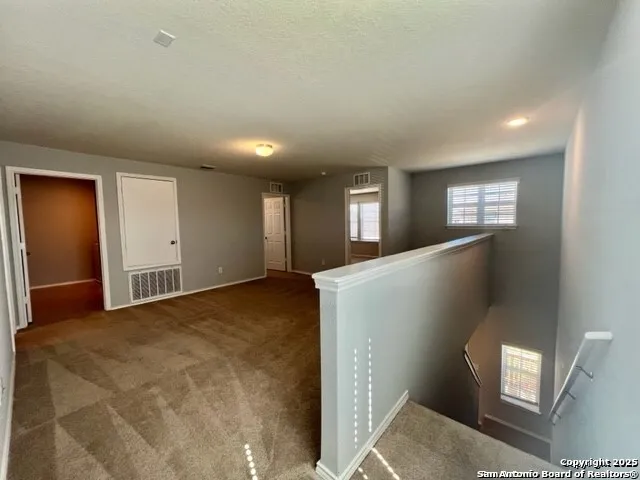 a view of livingroom with hardwood floor and hallway