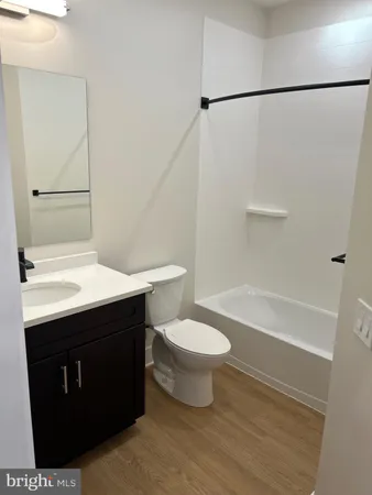 a bathroom with a sink a toilet and a bathtub