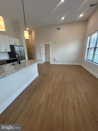 a view of a kitchen with a sink and dishwasher