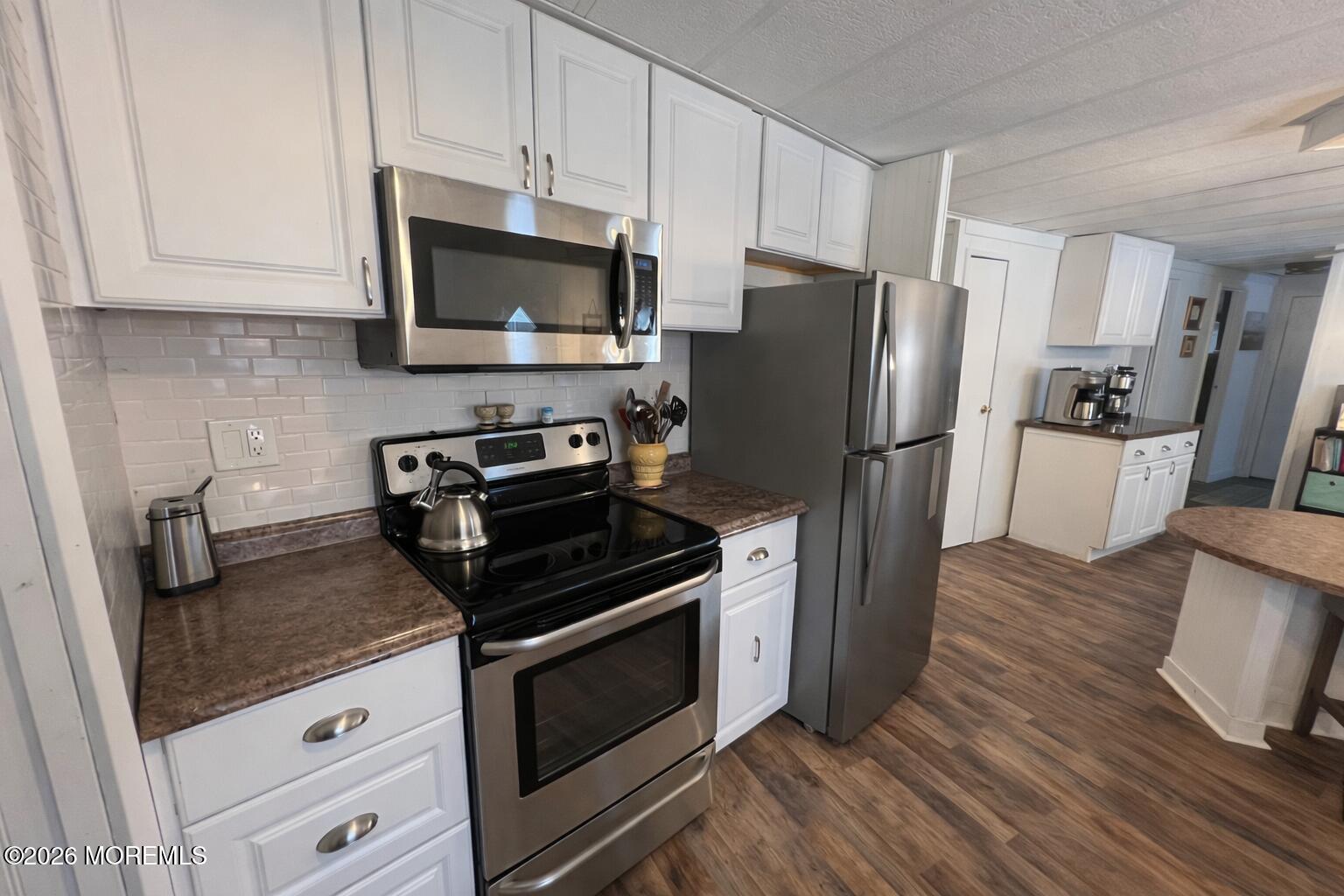 3 Arbor Street Whiting, NJ 08759 - Photo 14 of 42 a kitchen with stainless steel appliances a stove microwave and refrigerator