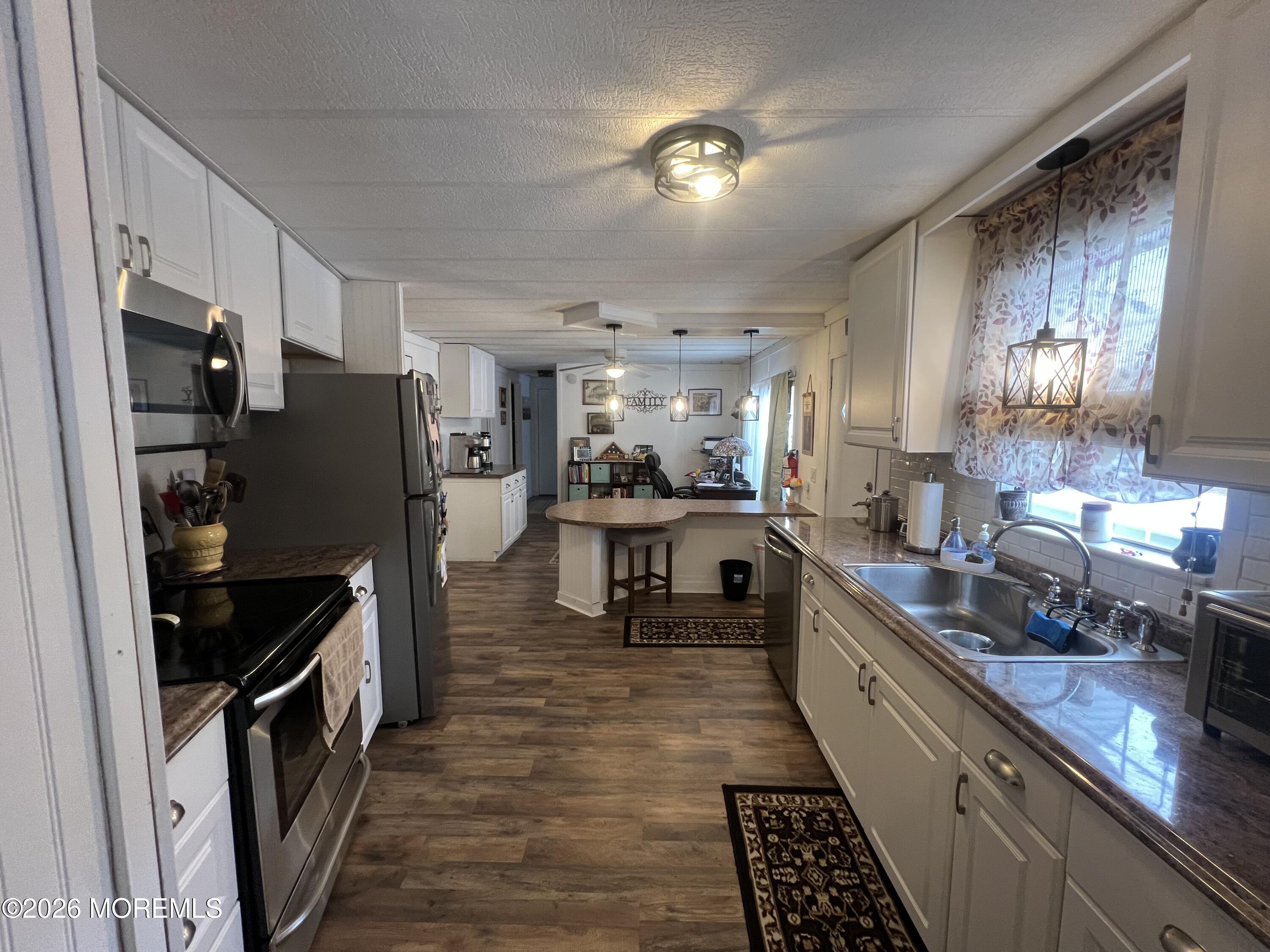 3 Arbor Street Whiting, NJ 08759 - Photo 27 of 42 a kitchen with stainless steel appliances granite countertop a refrigerator and a stove