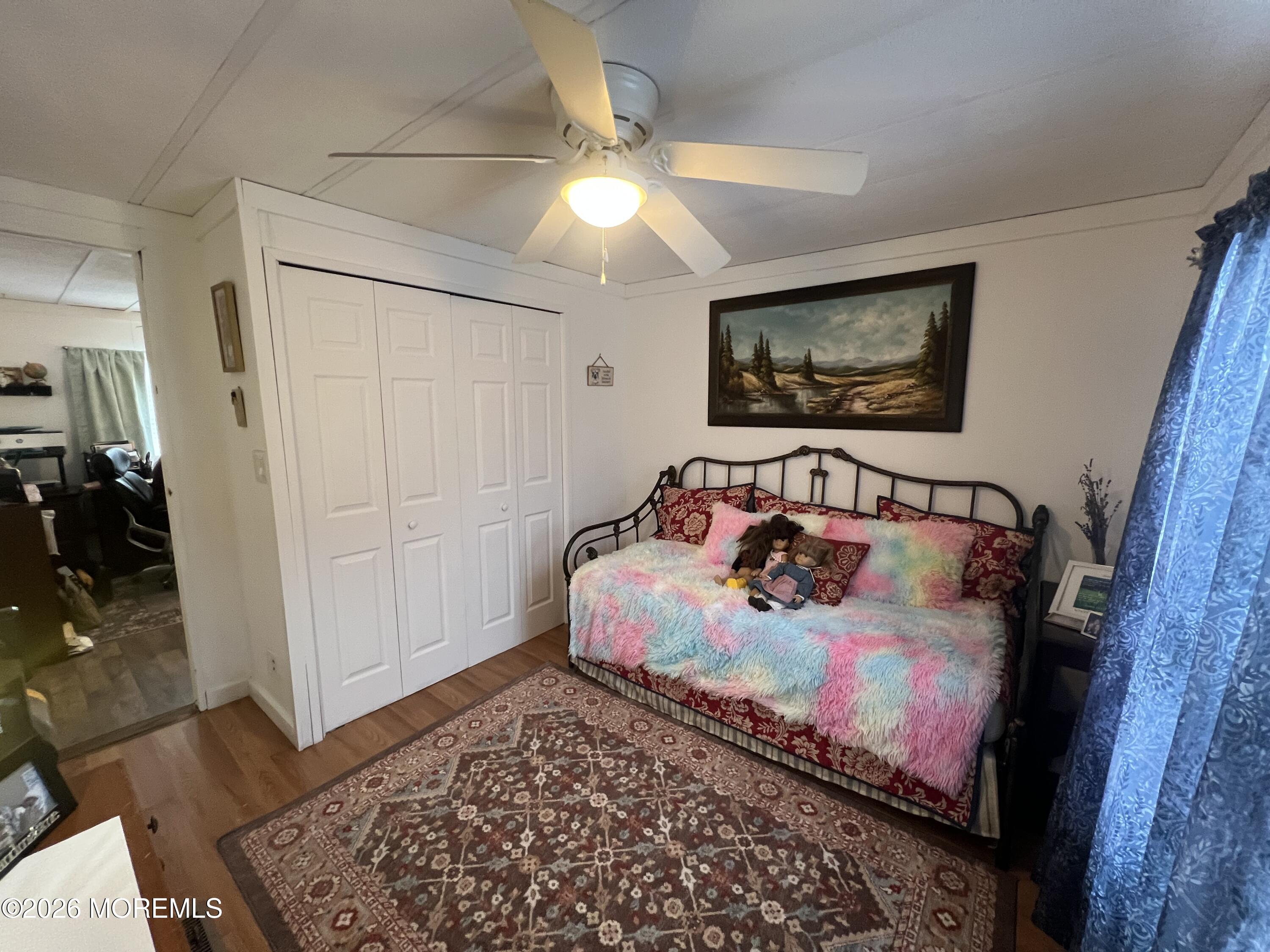 3 Arbor Street Whiting, NJ 08759 - Photo 29 of 42 a bedroom with bed and a painting on the wall