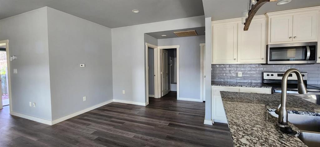 2235 North Pacific Street Mineola, TX 75773 - Photo 11 of 21 Hallway to bedrooms 2 & 3 with room for desk or additional eating area