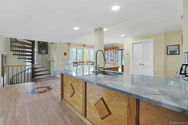 a spacious bathroom with stainless steel appliances granite countertop a sink and a granite counter tops