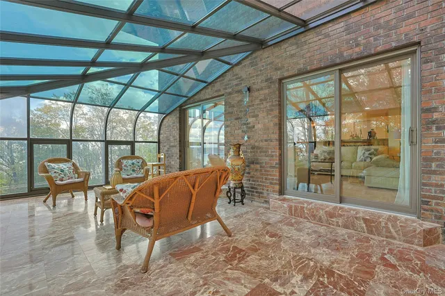 a view of chairs and table in patio