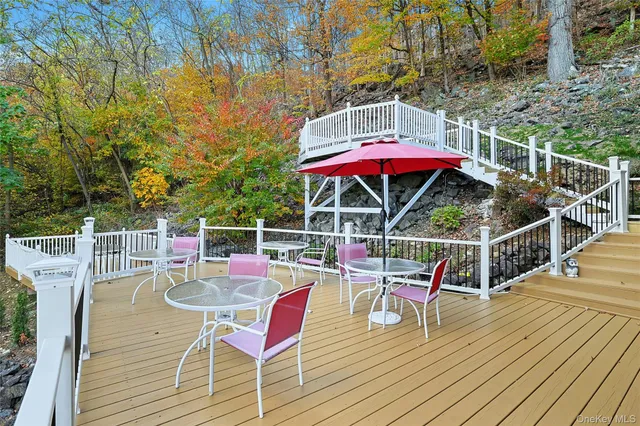a view of deck with furniture and barbeque oven