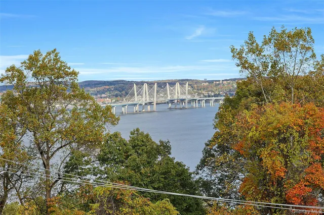 a view of a large body of water with a building in the background