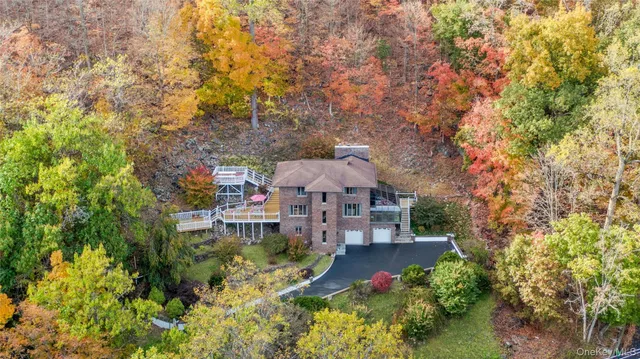 a view of a house with a yard and garden