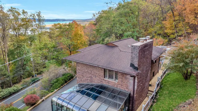 a aerial view of a house with a yard