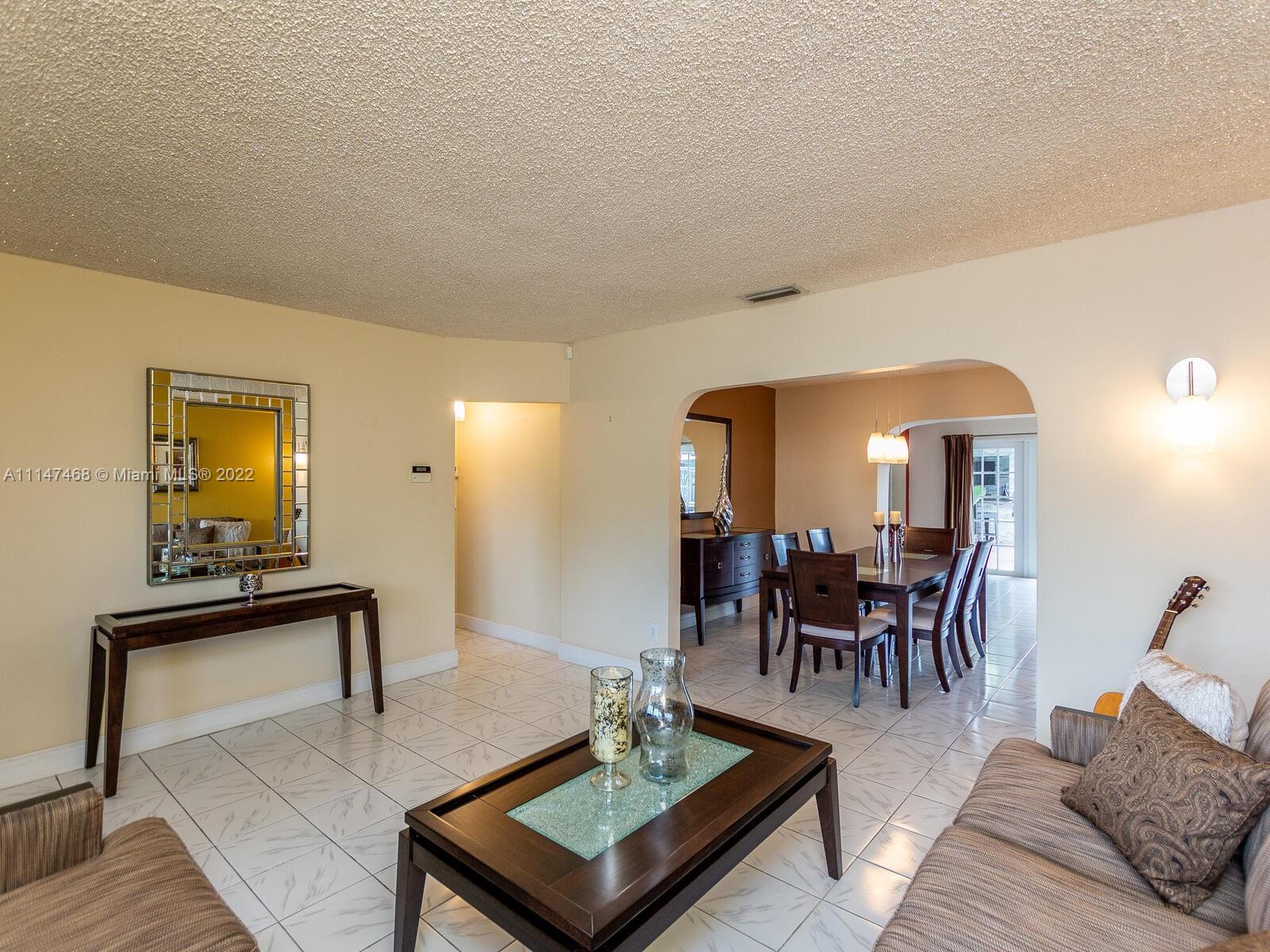 490 West 33rd Place Hialeah, FL 33012 - Photo 13 of 88 a living room with furniture and wooden floor