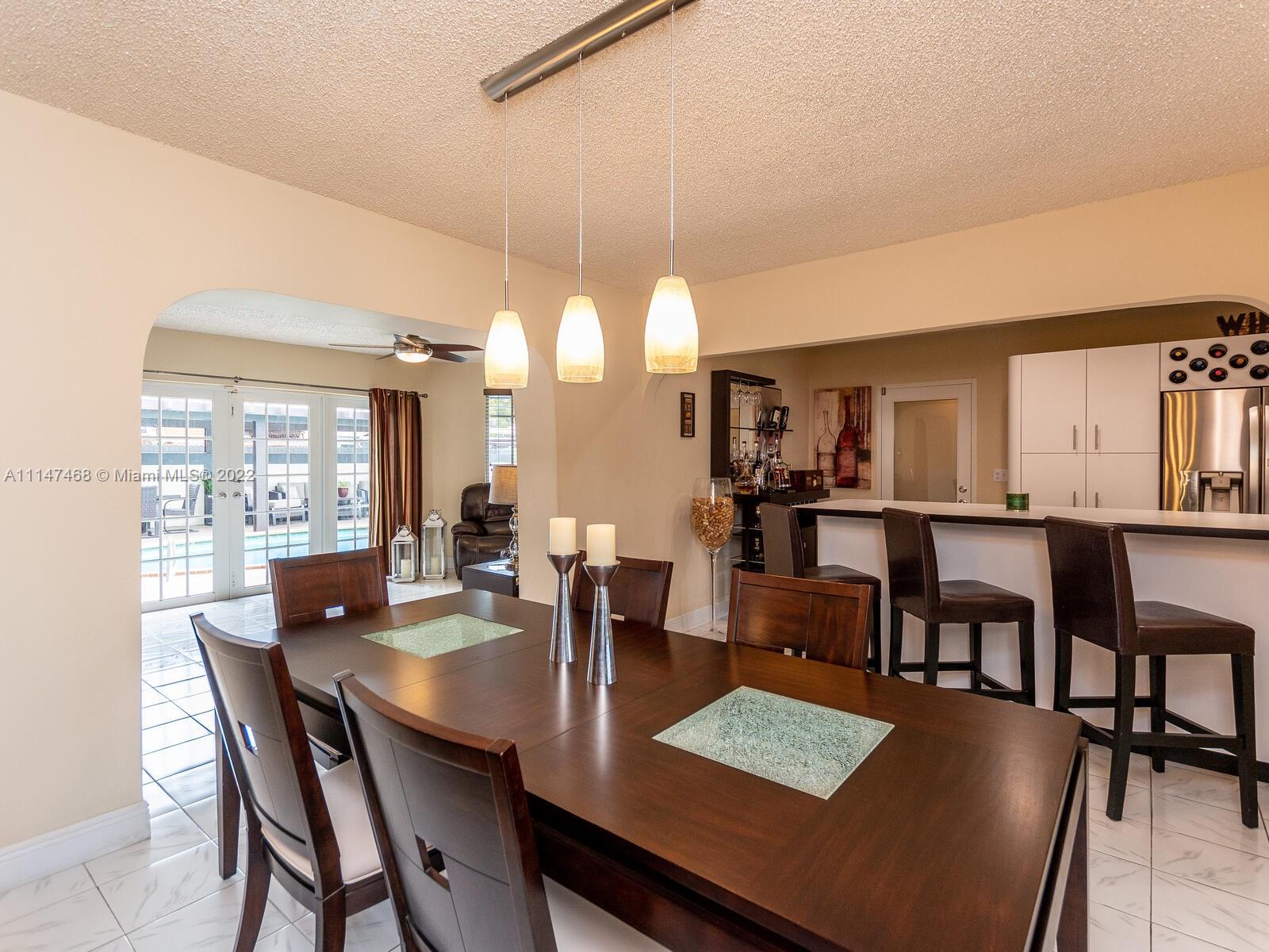 490 West 33rd Place Hialeah, FL 33012 - Photo 16 of 88 a view of a dining room with furniture and window