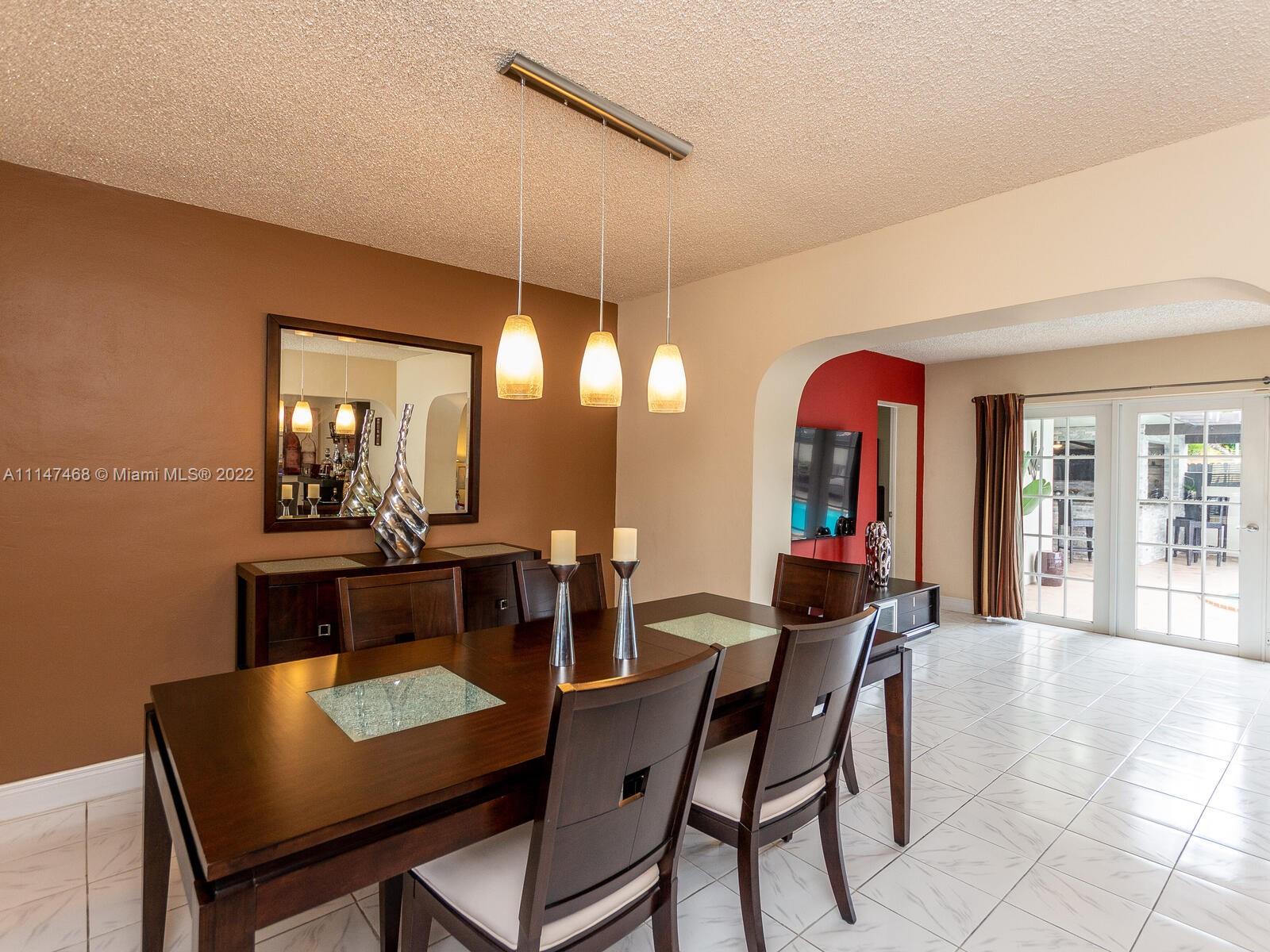 490 West 33rd Place Hialeah, FL 33012 - Photo 17 of 88 a dining room with furniture and window