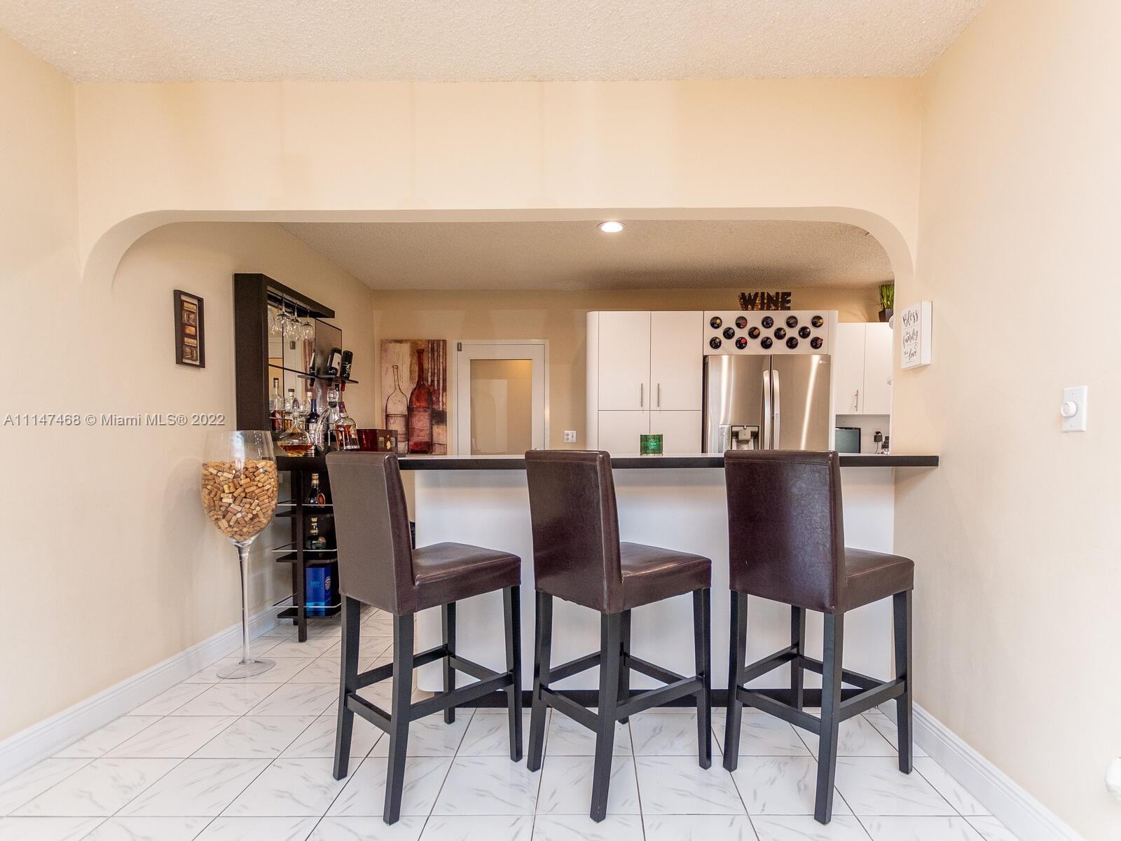 490 West 33rd Place Hialeah, FL 33012 - Photo 20 of 88 a view of a dining room with furniture and window