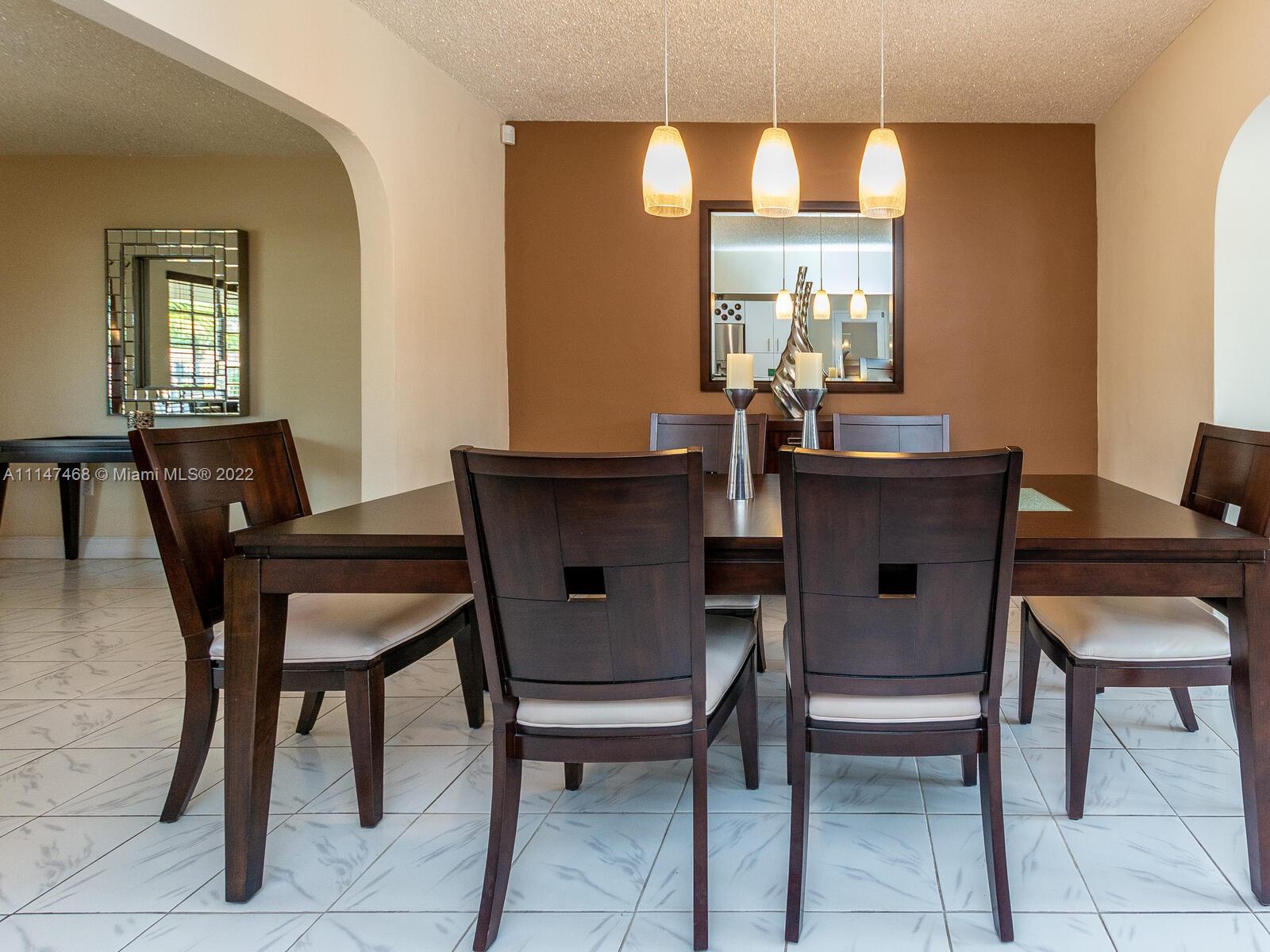 490 West 33rd Place Hialeah, FL 33012 - Photo 21 of 88 a view of a dining room with furniture