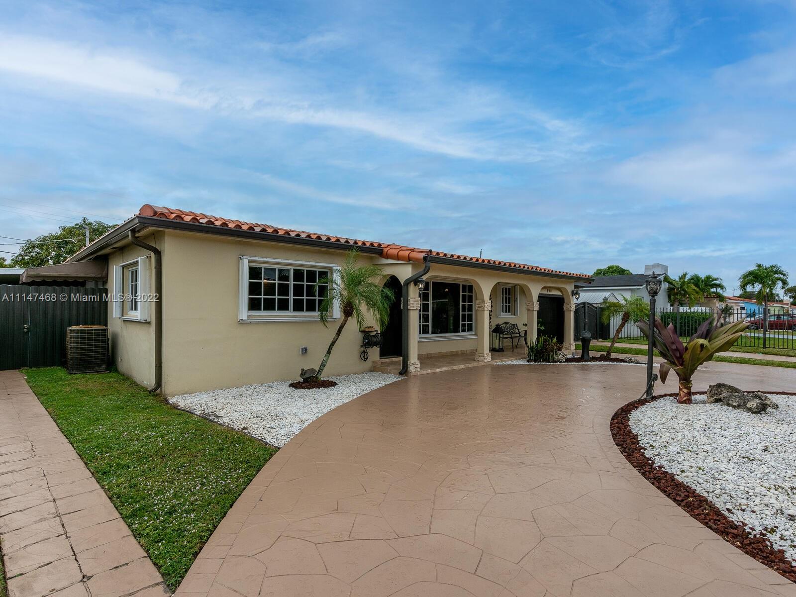 490 West 33rd Place Hialeah, FL 33012 - Photo 6 of 88 a view of a house with backyard sitting area and garden