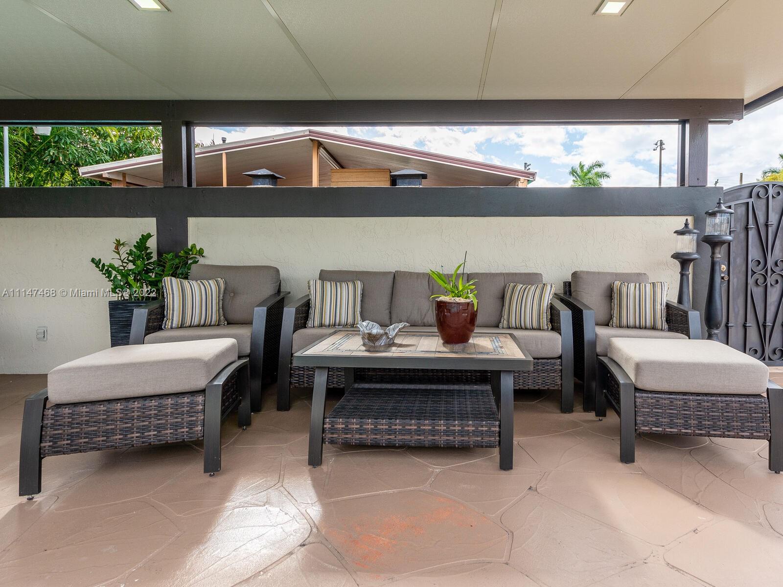 490 West 33rd Place Hialeah, FL 33012 - Photo 61 of 88 a living room with furniture and a potted plant