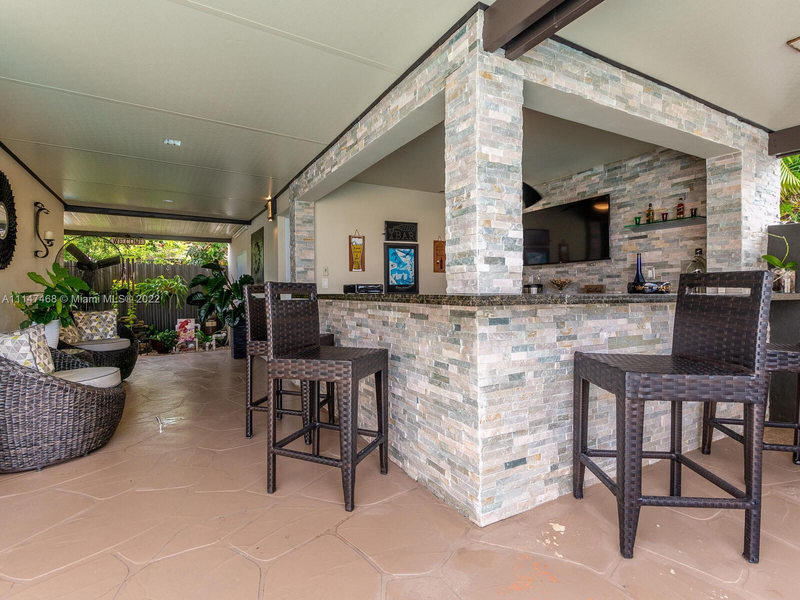 490 West 33rd Place Hialeah, FL 33012 - Photo 66 of 88 a living room with fireplace furniture and a flat screen tv