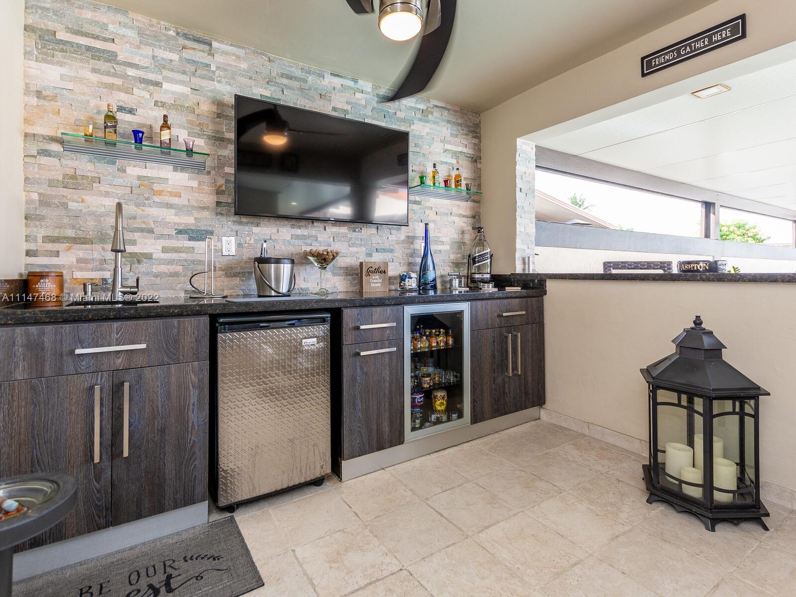 490 West 33rd Place Hialeah, FL 33012 - Photo 68 of 88 a kitchen with stainless steel appliances a stove a sink and a microwave