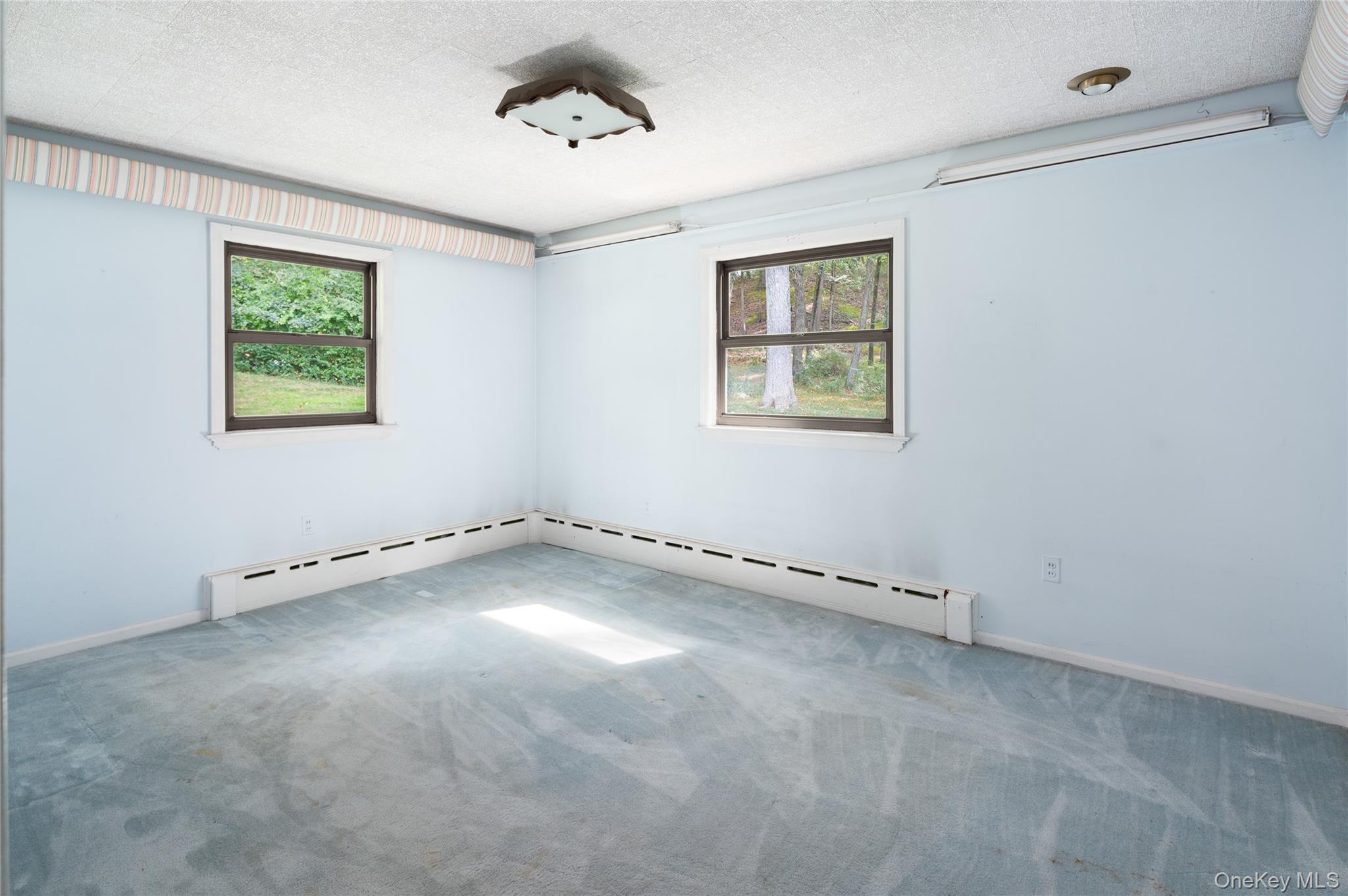 28 Alice Road Mount Kisco, NY 10549 - Photo 21 of 32 an empty room with a window