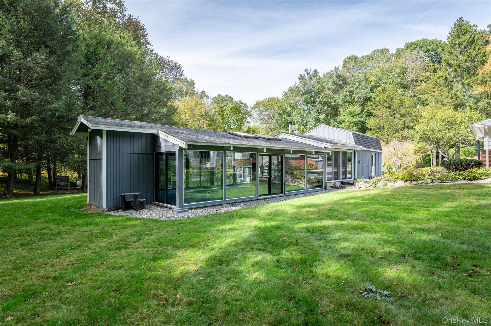 28 Alice Road Mount Kisco, NY 10549 - Photo 23 of 32 a view of a house with a yard and sitting area
