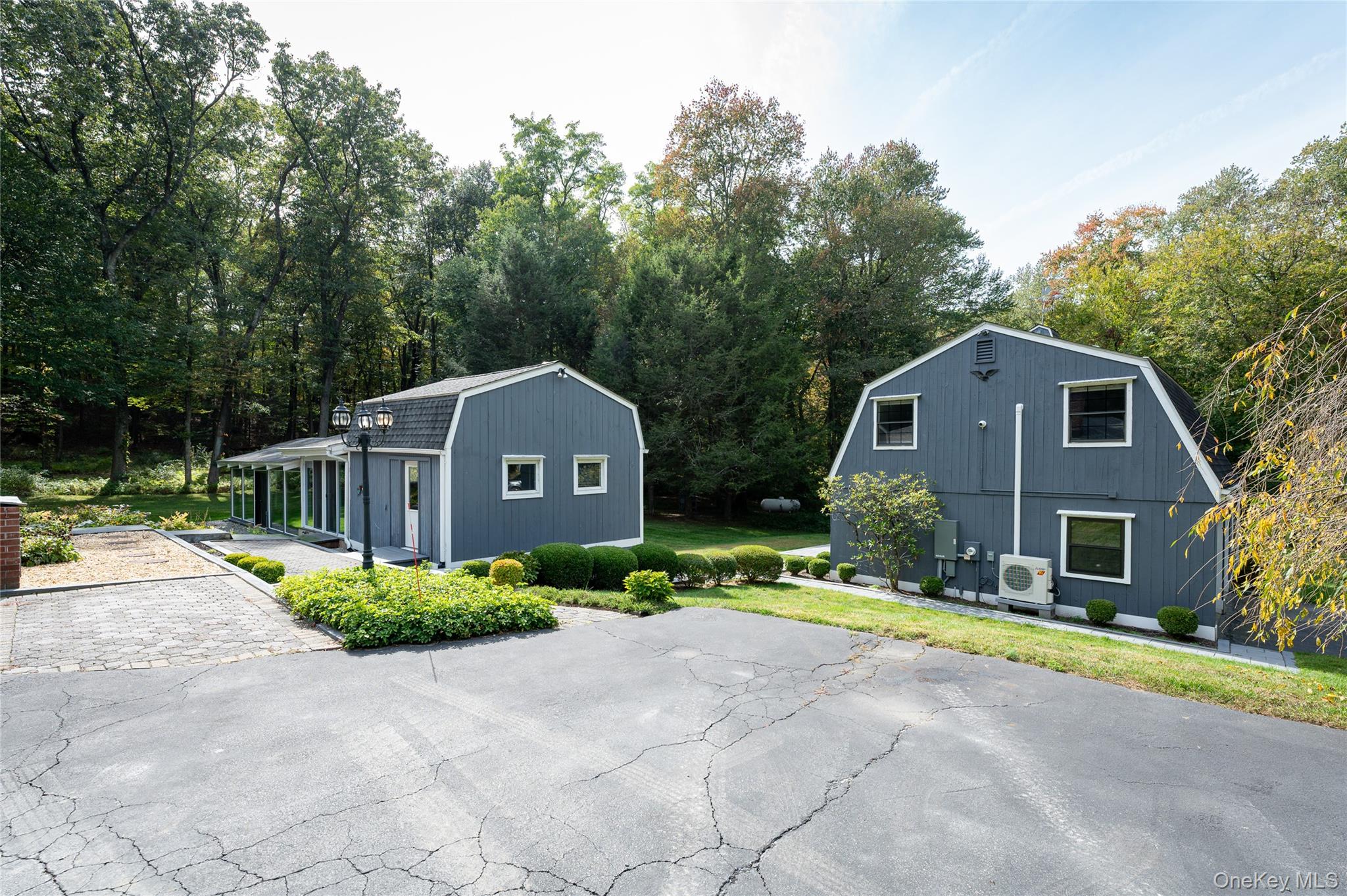 28 Alice Road Mount Kisco, NY 10549 - Photo 31 of 32 a front view of a house with a yard and garage
