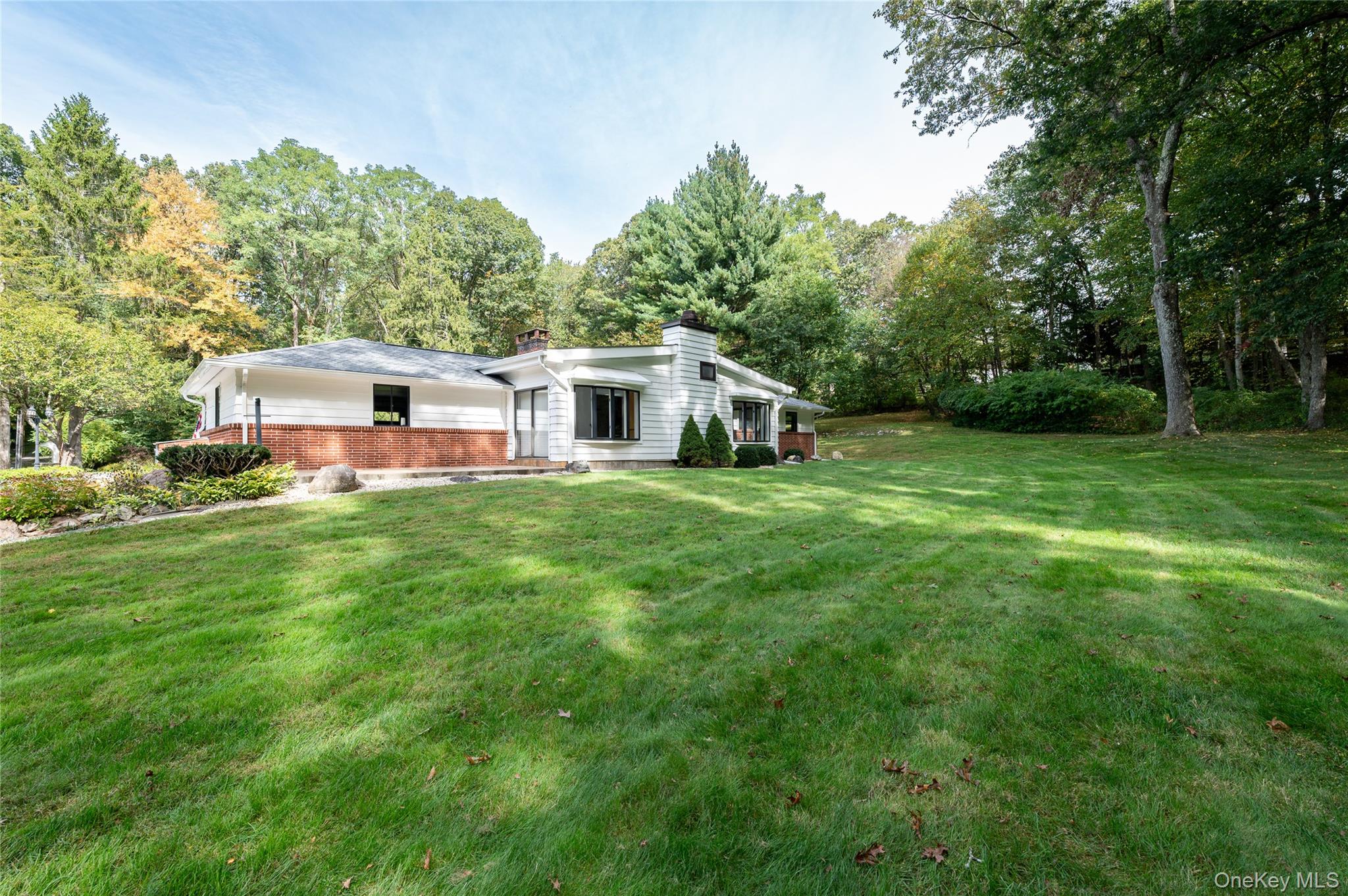 28 Alice Road Mount Kisco, NY 10549 - Photo 4 of 32 a house view with a outdoor space