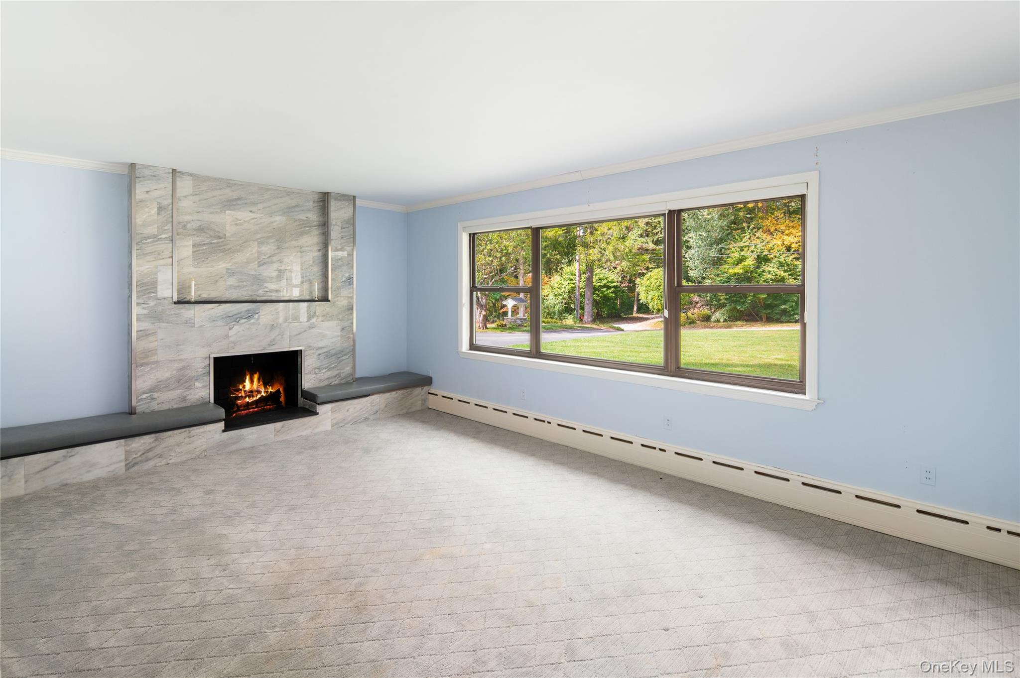 28 Alice Road Mount Kisco, NY 10549 - Photo 6 of 32 an empty room with fireplace and windows