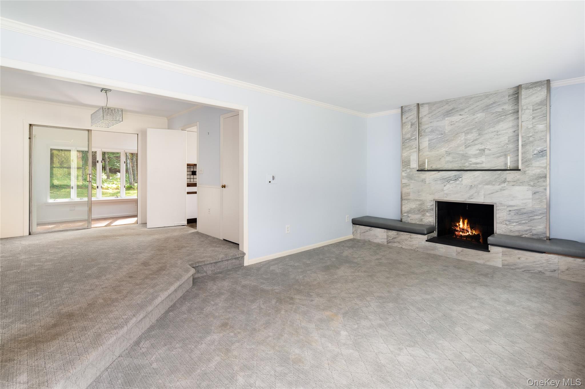 28 Alice Road Mount Kisco, NY 10549 - Photo 8 of 32 a view of an empty room with a window and fireplace