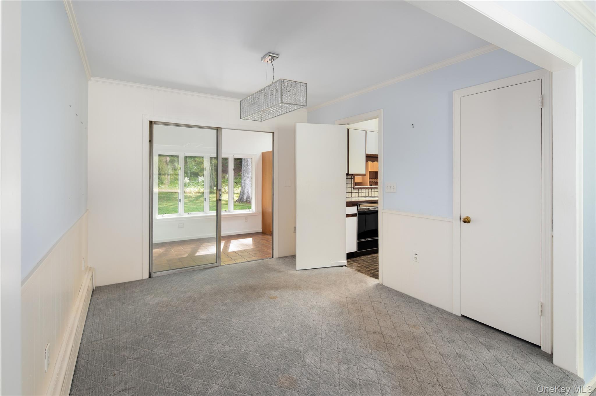 28 Alice Road Mount Kisco, NY 10549 - Photo 9 of 32 a view of a kitchen with an empty space and a window