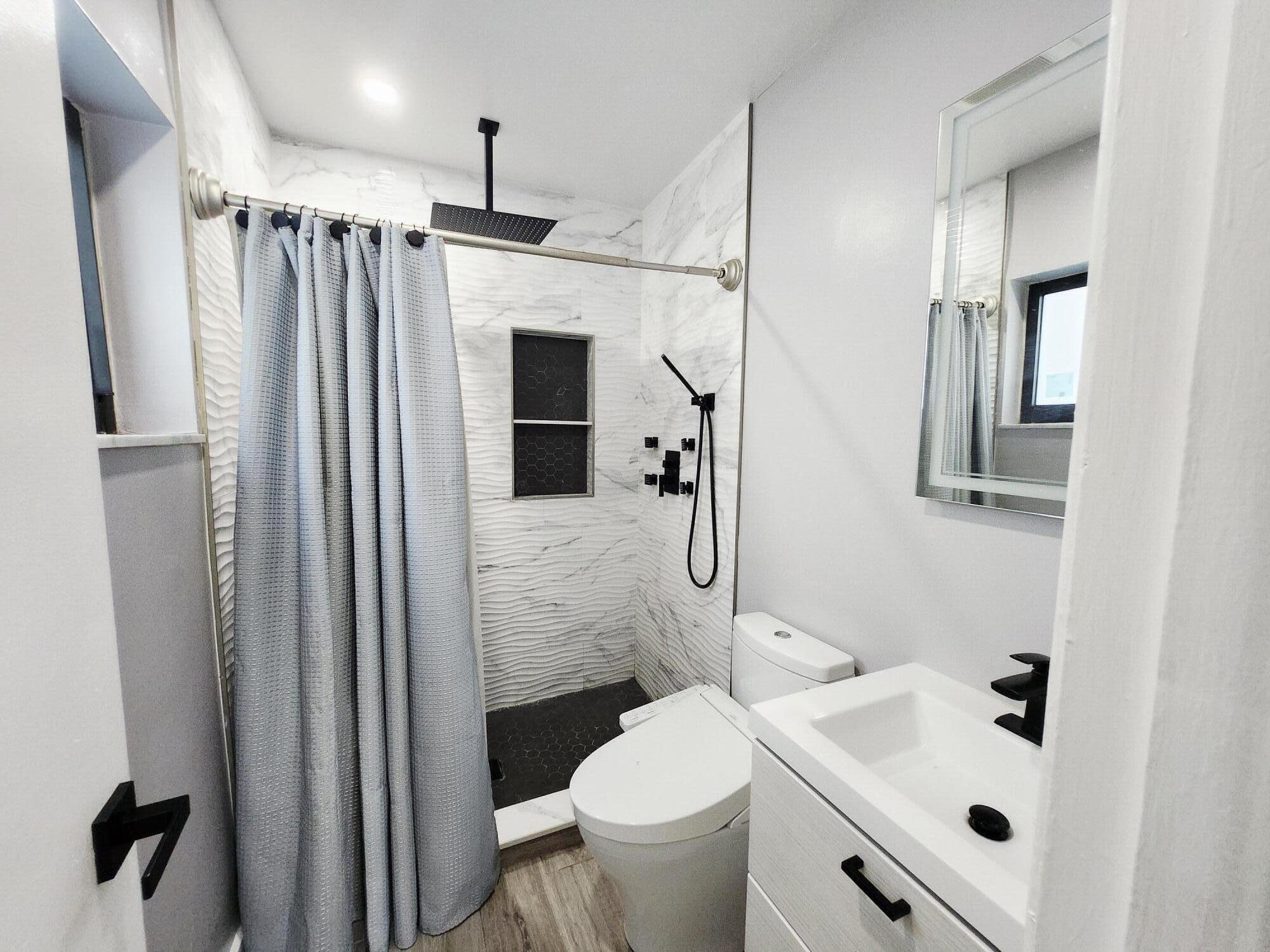 19471 Colorado Circle Boca Raton, FL 33434 - Photo 15 of 22 a bathroom with a sink toilet and shower