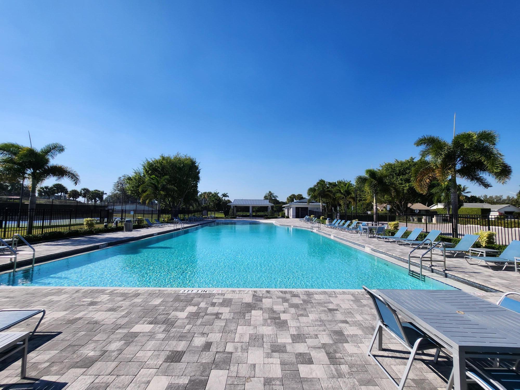 19471 Colorado Circle Boca Raton, FL 33434 - Photo 18 of 22 a view of a swimming pool and lounge chairs