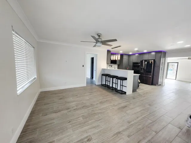 a view of a kitchen with a sink and a window
