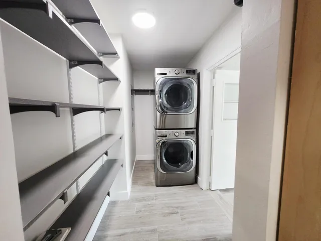 a view of a hallway with washer and dryer